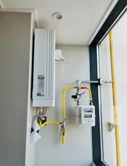 Why must the gas meter be installed inside the house?